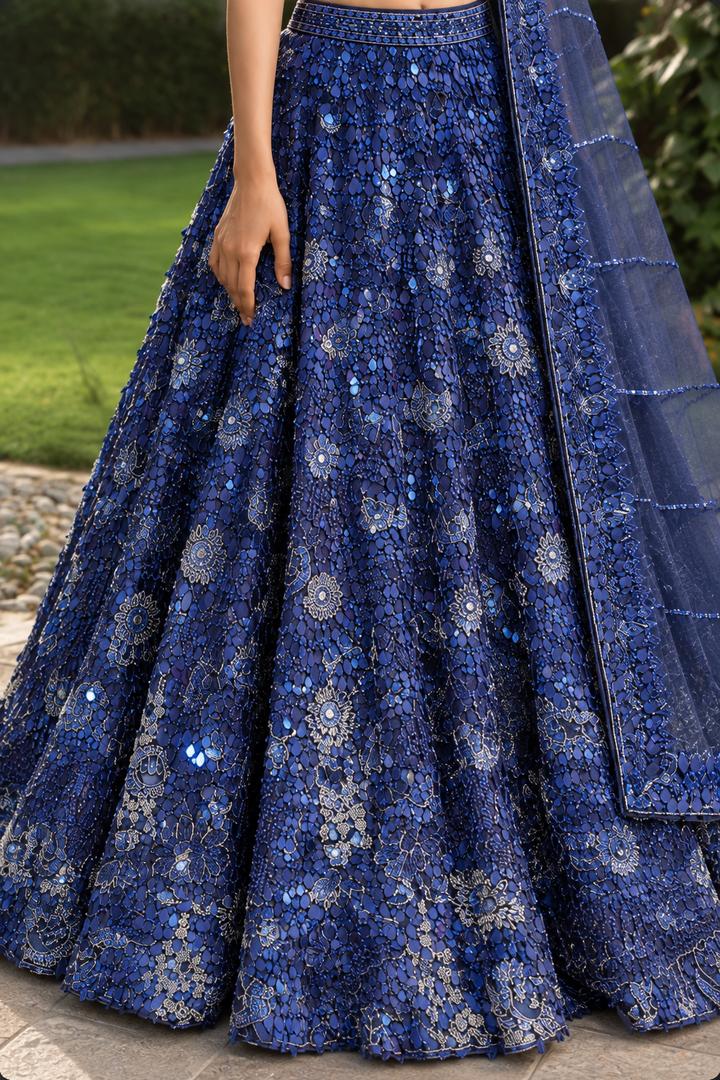Net Lehenga with Aari, Cutdana, Sequins work.