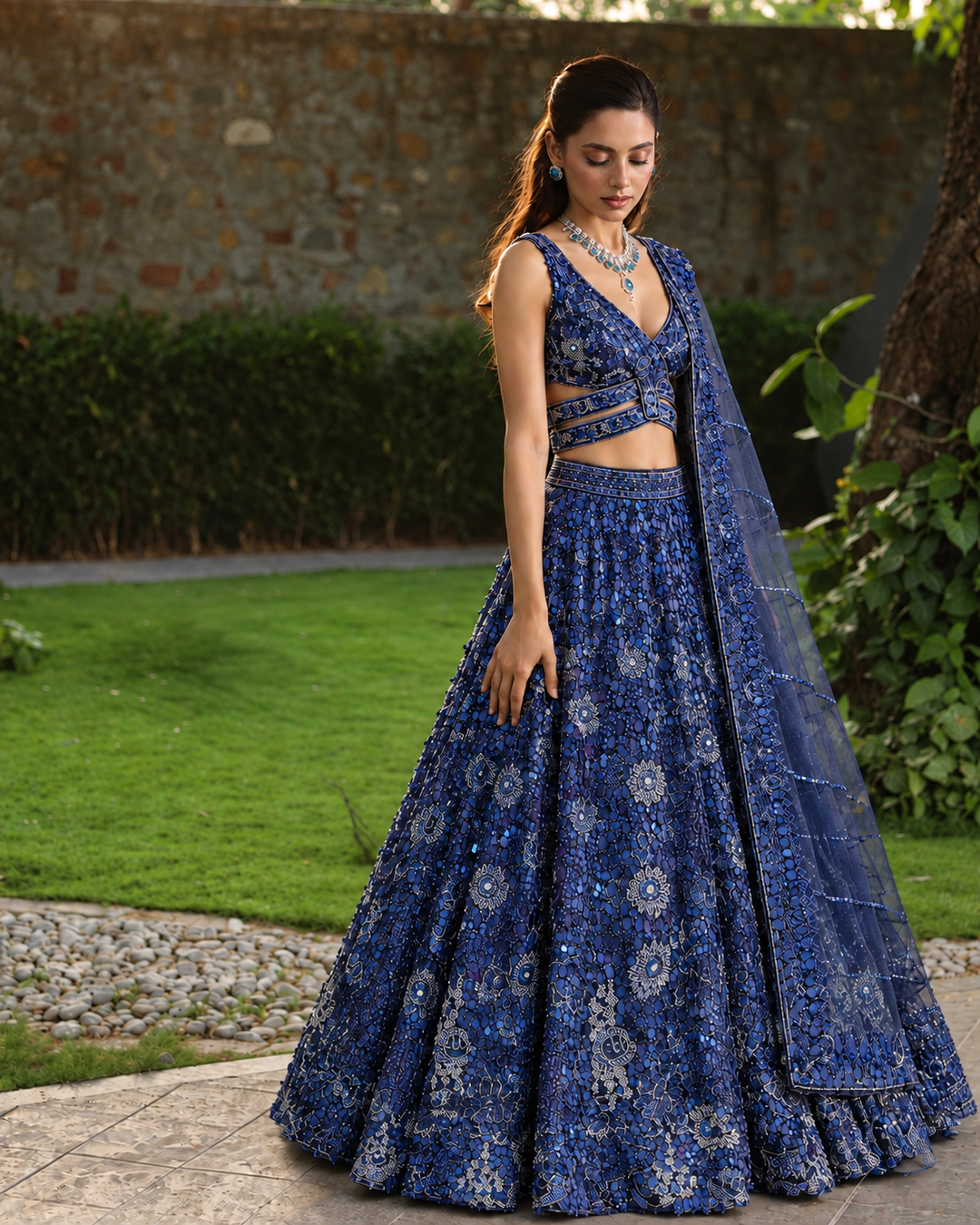 Net Lehenga with Aari, Cutdana, Sequins work.