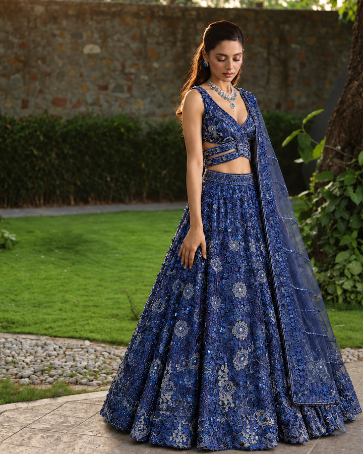 Net Lehenga with Aari, Cutdana, Sequins work.