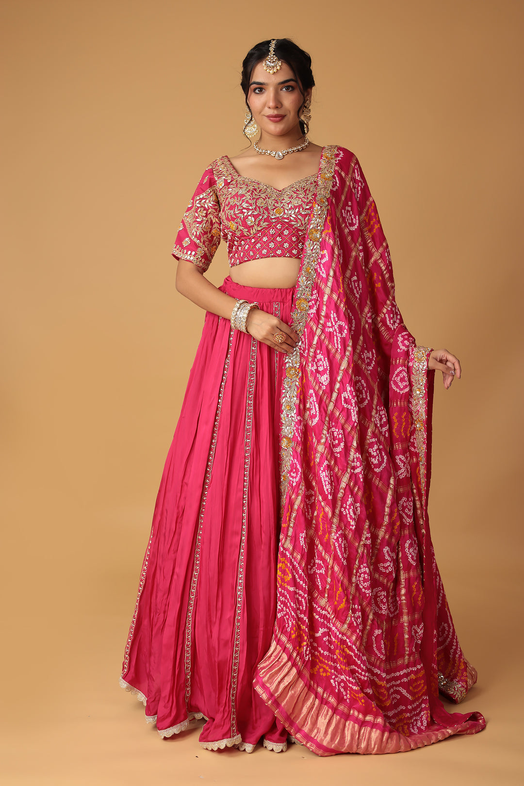 Bandhej Silk Lehenga Embellished with Gota Patti, Thread and Zardozi work.