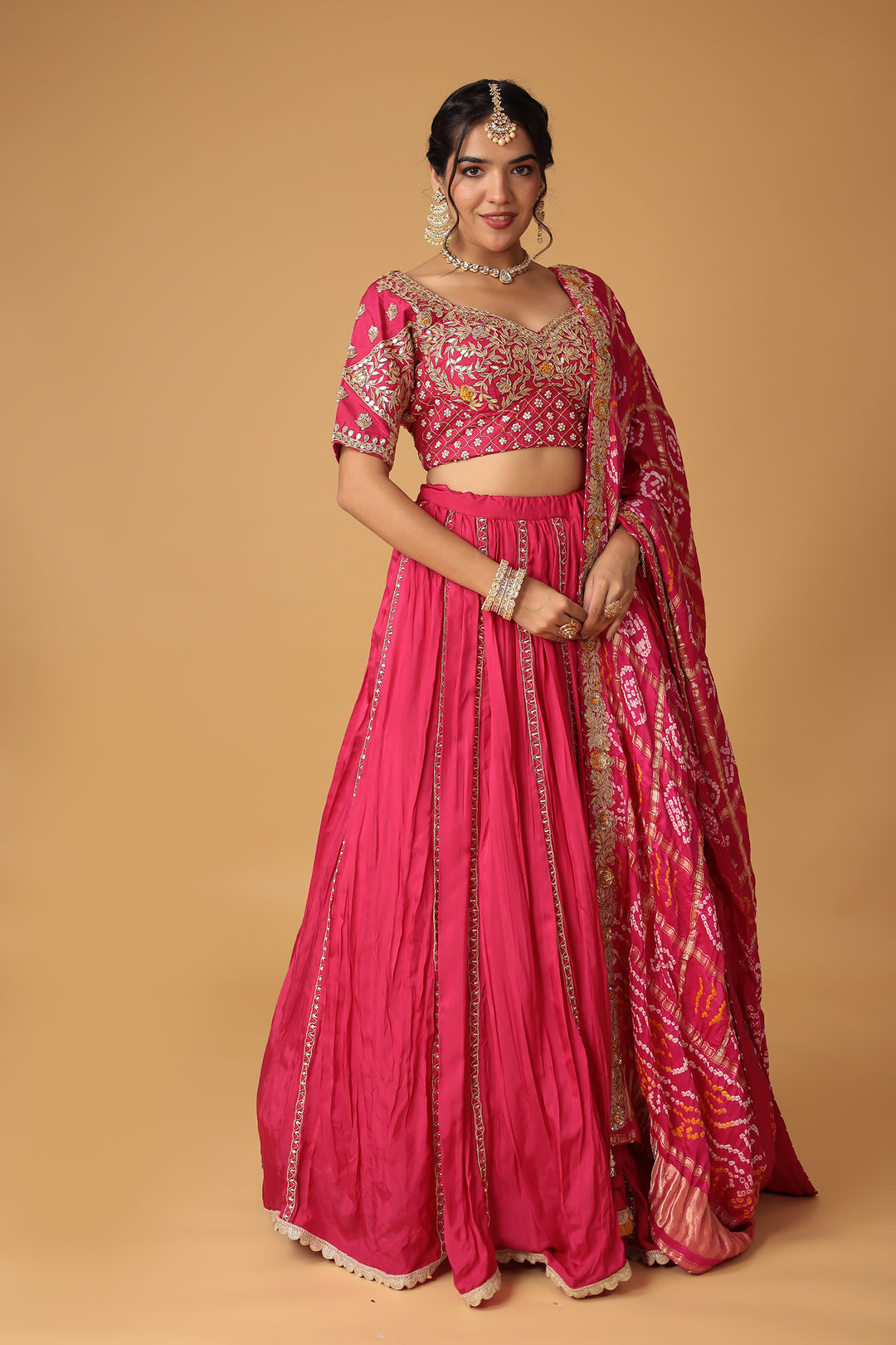 Bandhej Silk Lehenga Embellished with Gota Patti, Thread and Zardozi work.