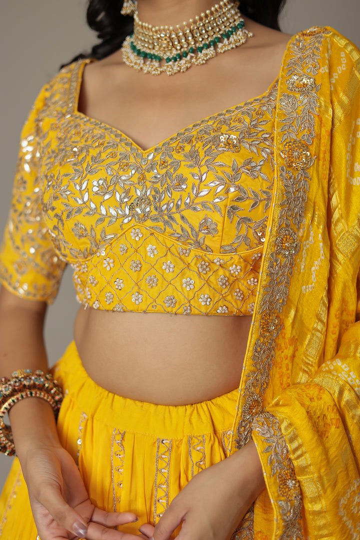Bandhej Silk Lehenga Embellished with Gota Patti, Thread and Zardozi work.
