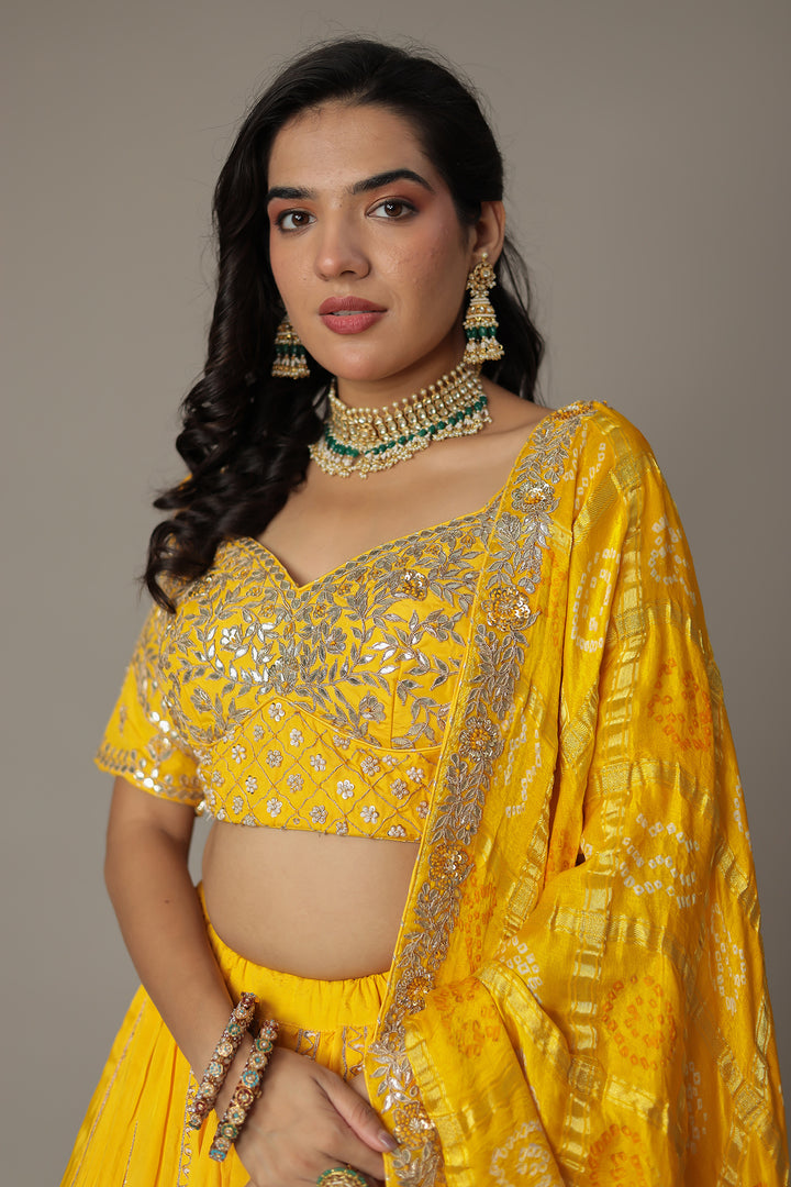 Bandhej Silk Lehenga Embellished with Gota Patti, Thread and Zardozi work.