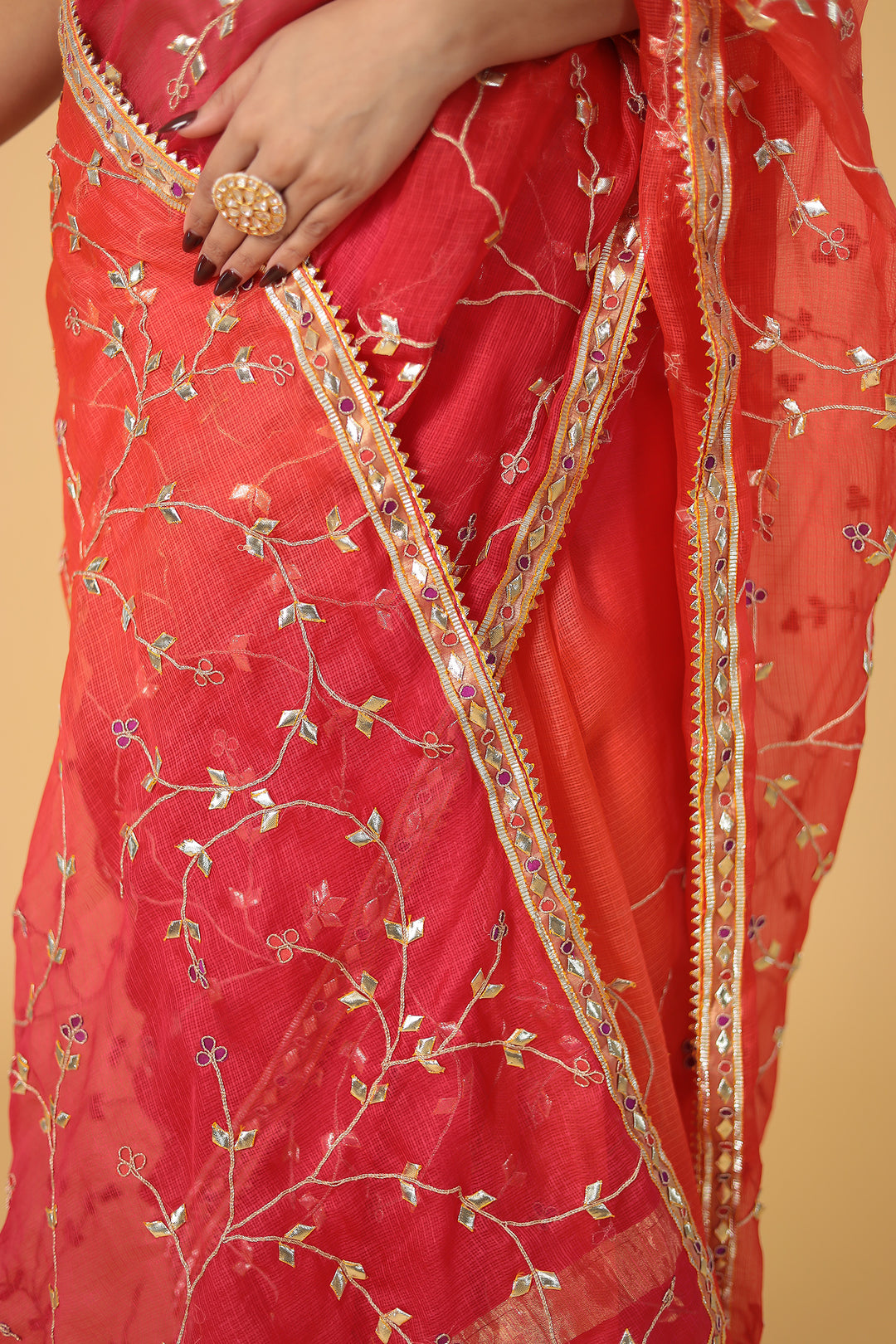 Red saree with gold embroidery