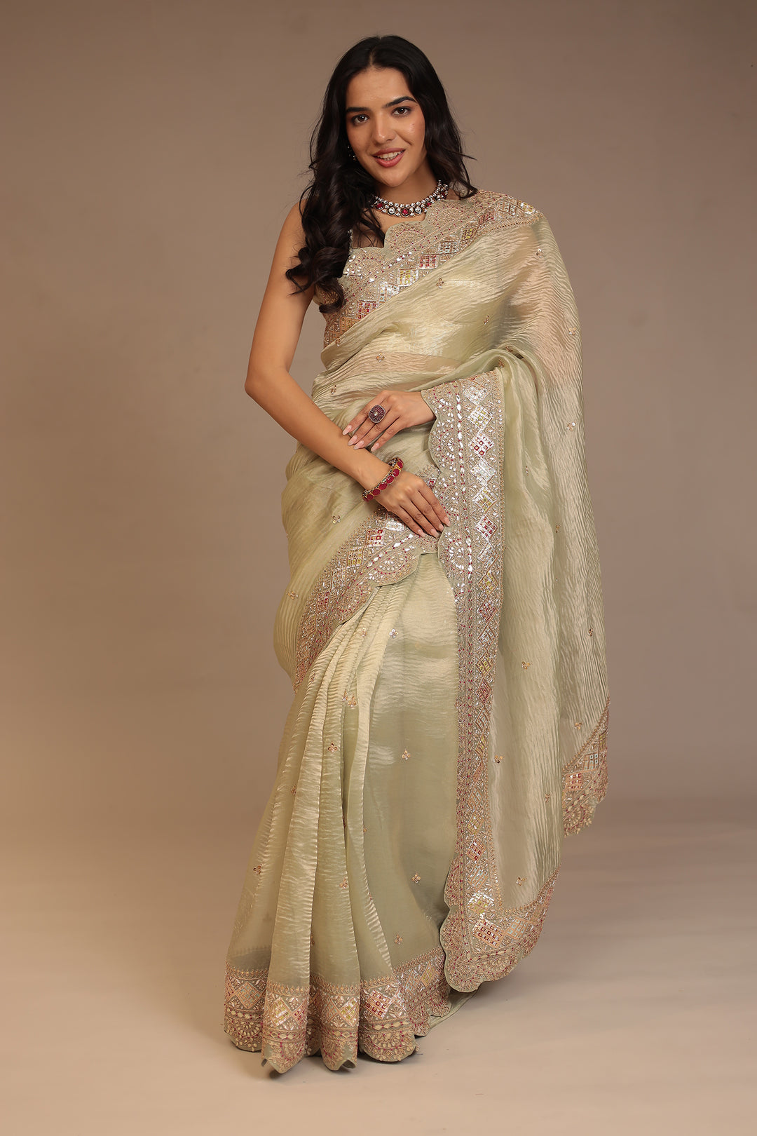 Tissue Saree with Dori, Gota Patti, Mirror, Pearl, Sequins, Zardozi work.
