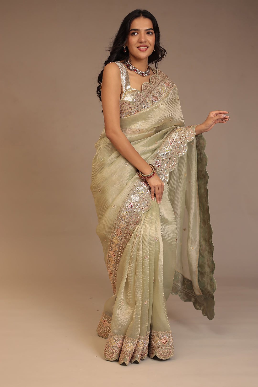 Tissue Saree with Dori, Gota Patti, Mirror, Pearl, Sequins, Zardozi work.
