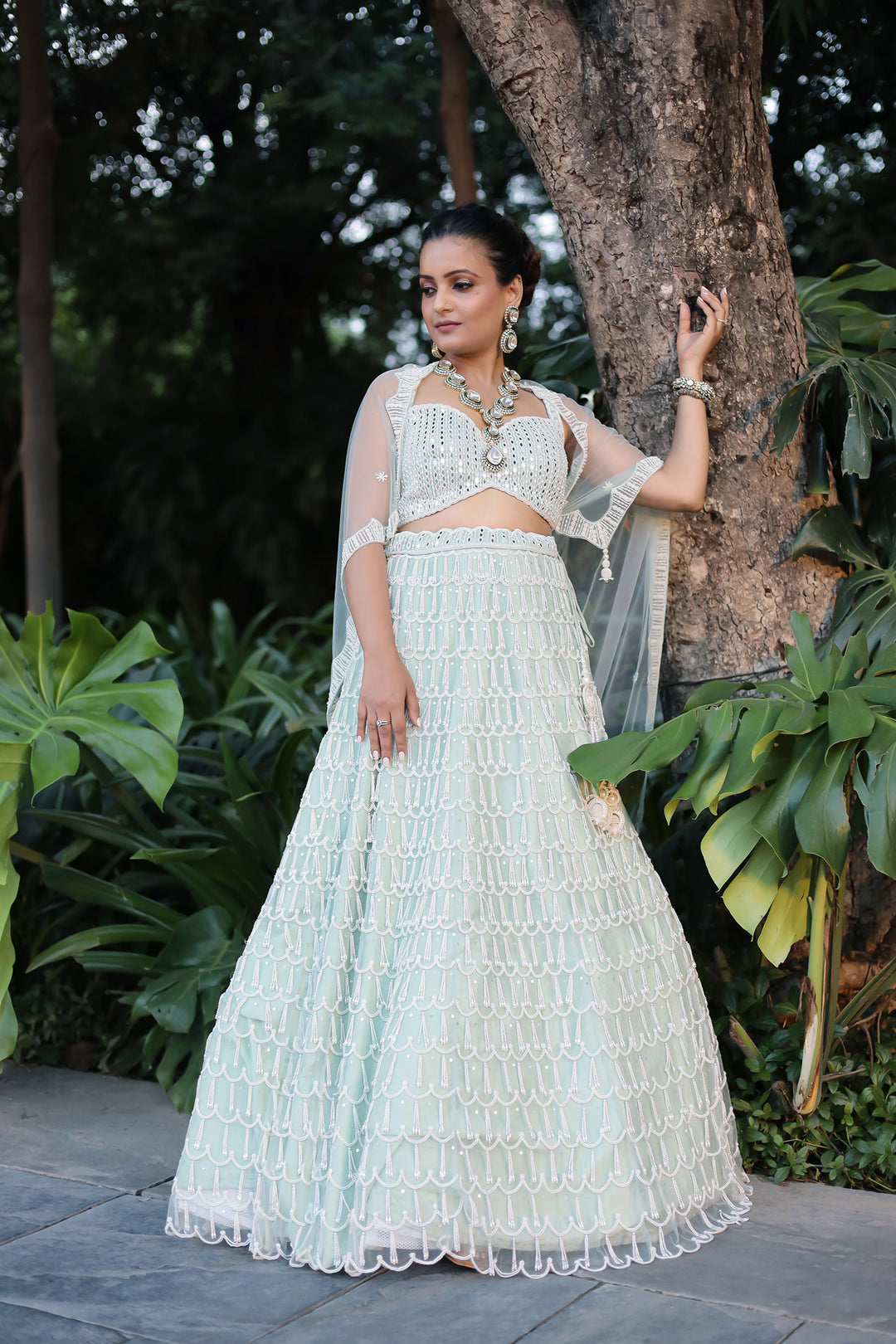 Graceful Net Lehenga Featuring Intricate Pearl Detailing